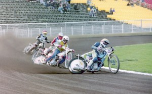 SPEEDWAY RIDERS IN ACTION ON THE TRACK